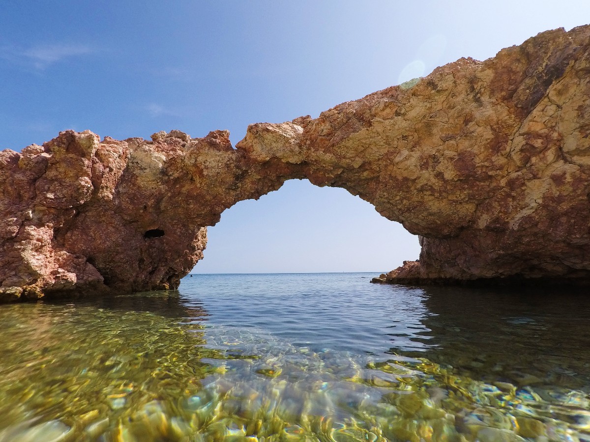 Explore the sea caves in Milos island