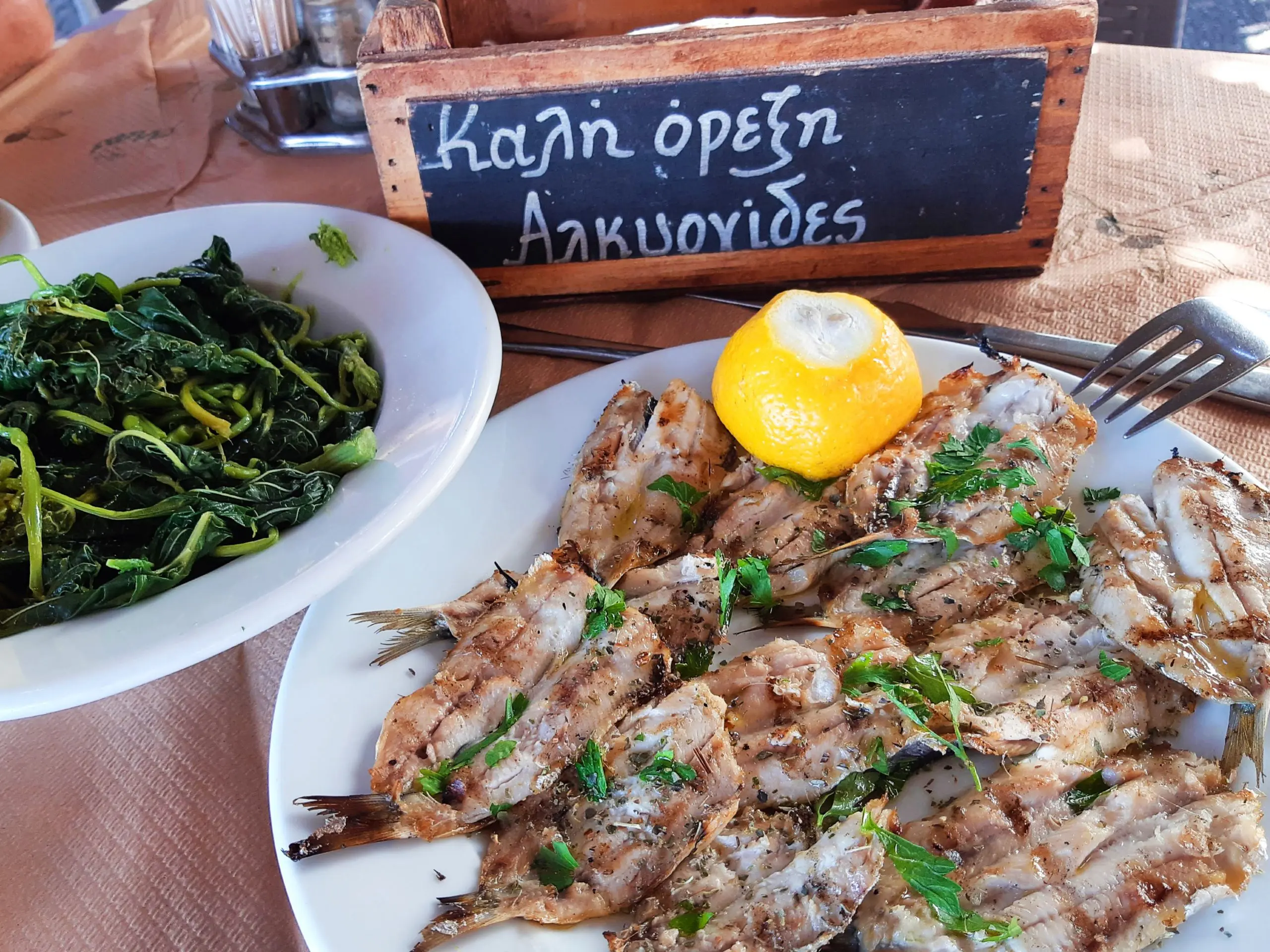 Grilled sardines served with horta