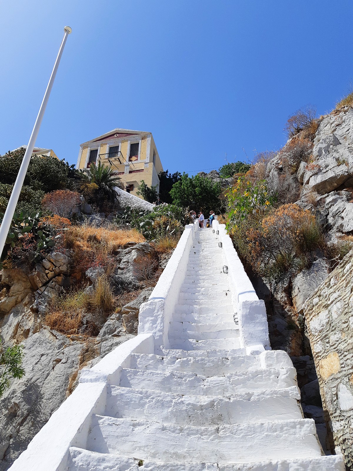 Walking up stairs in Symi Greece