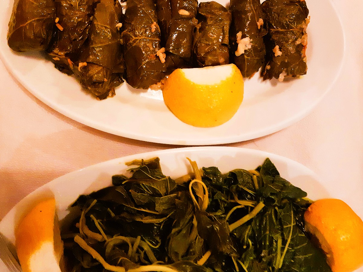 Greek dishes dolmadakia and horta