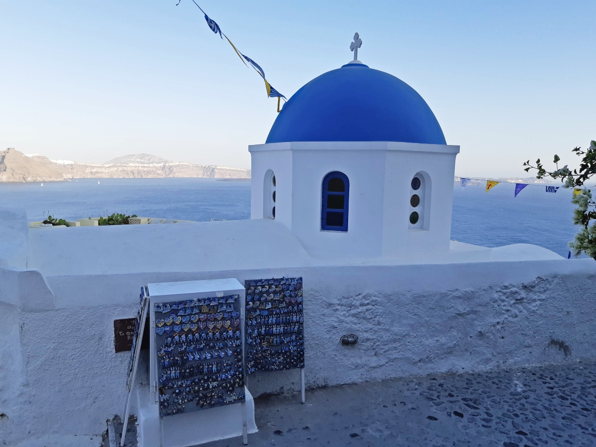 Blue-domed church in Oia Santorini Greece