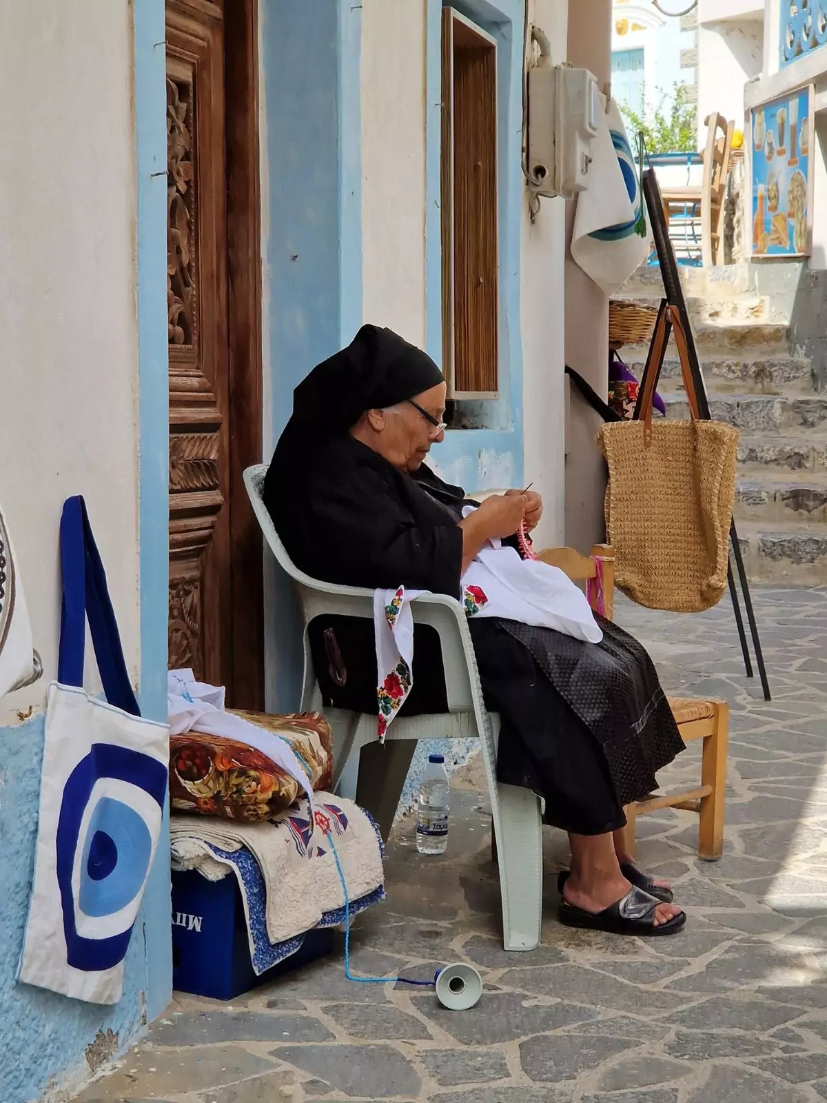 Tips for a summer vacation in Greece - A woman in Olympos Karpathos