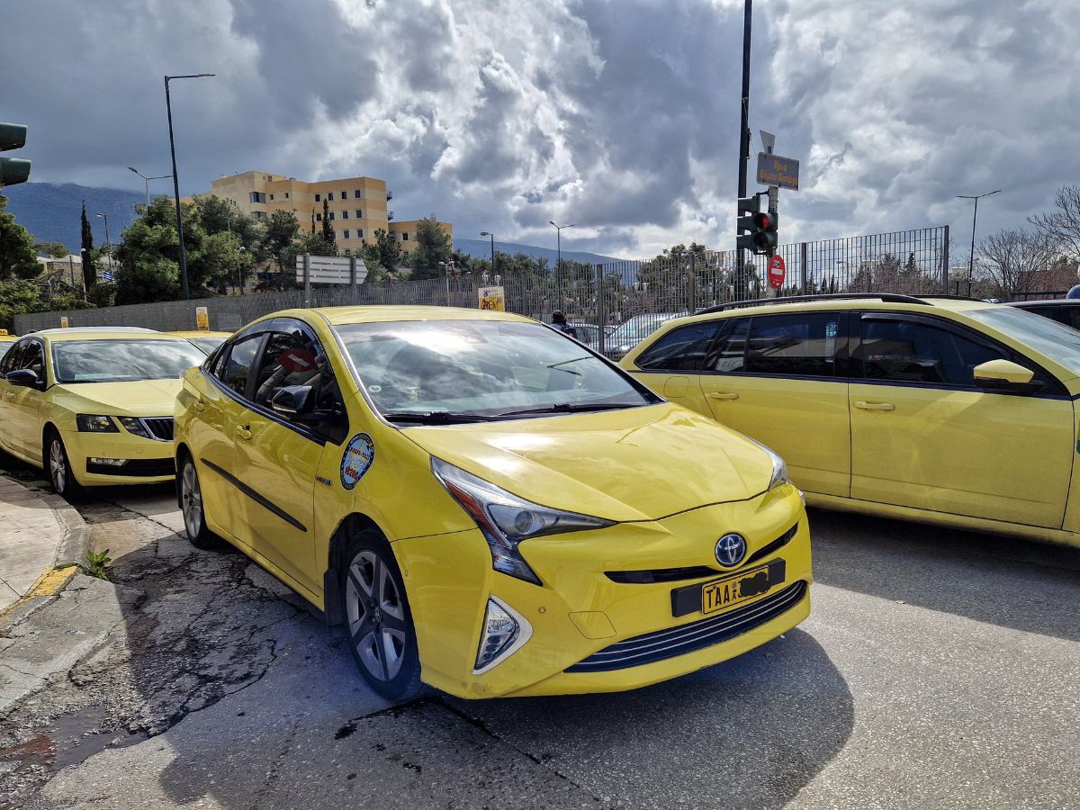 A yellow taxi in Athens Greece