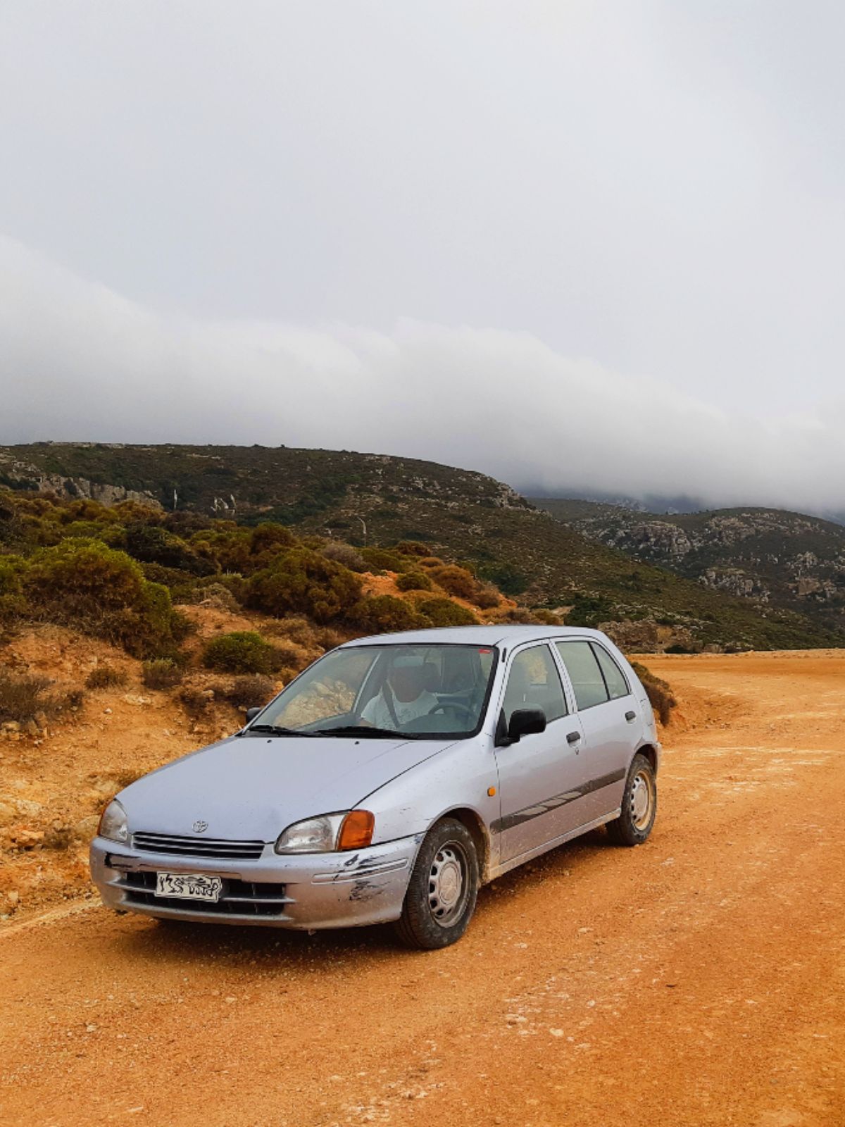 A car on a dirt road in Milos Greece